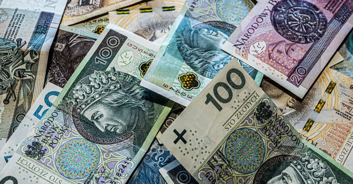 A collection of Polish Zloty banknotes in various denominations, scattered.